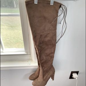Tan over the knee boots.
